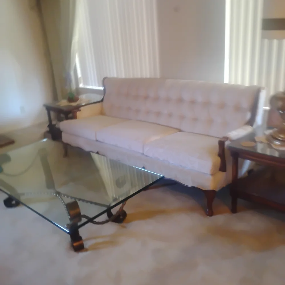 Elegant Glass Coffee Table with Black Metal Accents